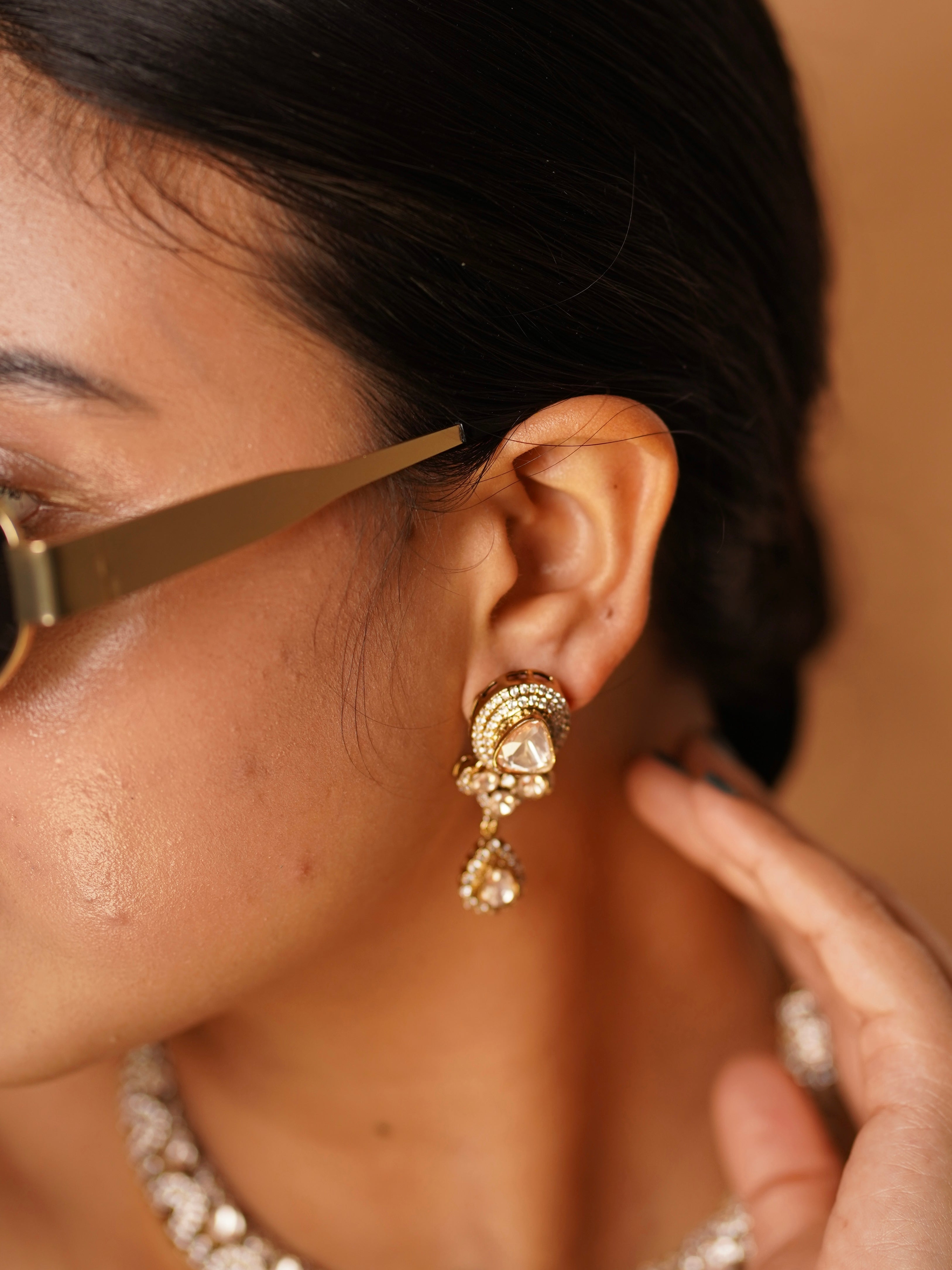 Earrings from Aarvika necklace set with teardrop danglers and radiant gold-plated detailing